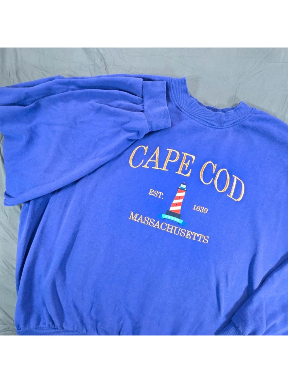 Cape Cod lighthouse graphic and gold lettering